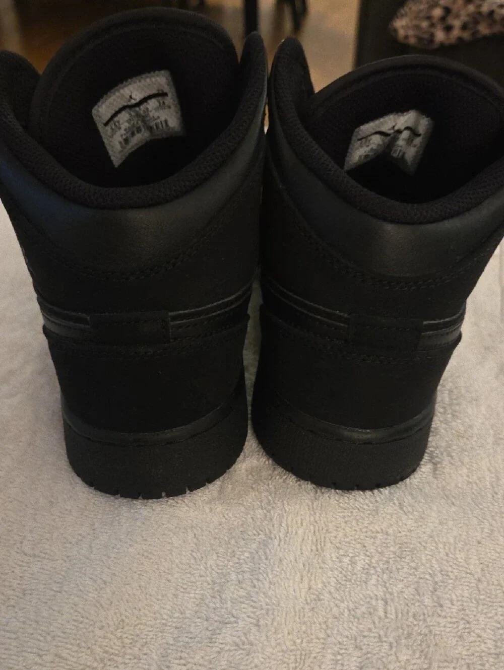 Jordan Kids Black and White High-Top Sneakers